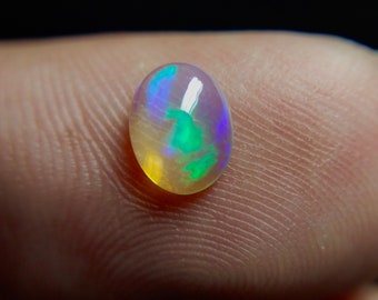 50/% discount on 0.60 ct Ethiopian welo opal.. Fire opal CABOCHON... 8x6 mm