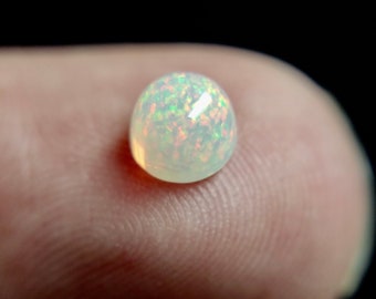 50/% discount on 0.60 ct Ethiopian welo opal.. Fire opal CABOCHON... 8x6 mm