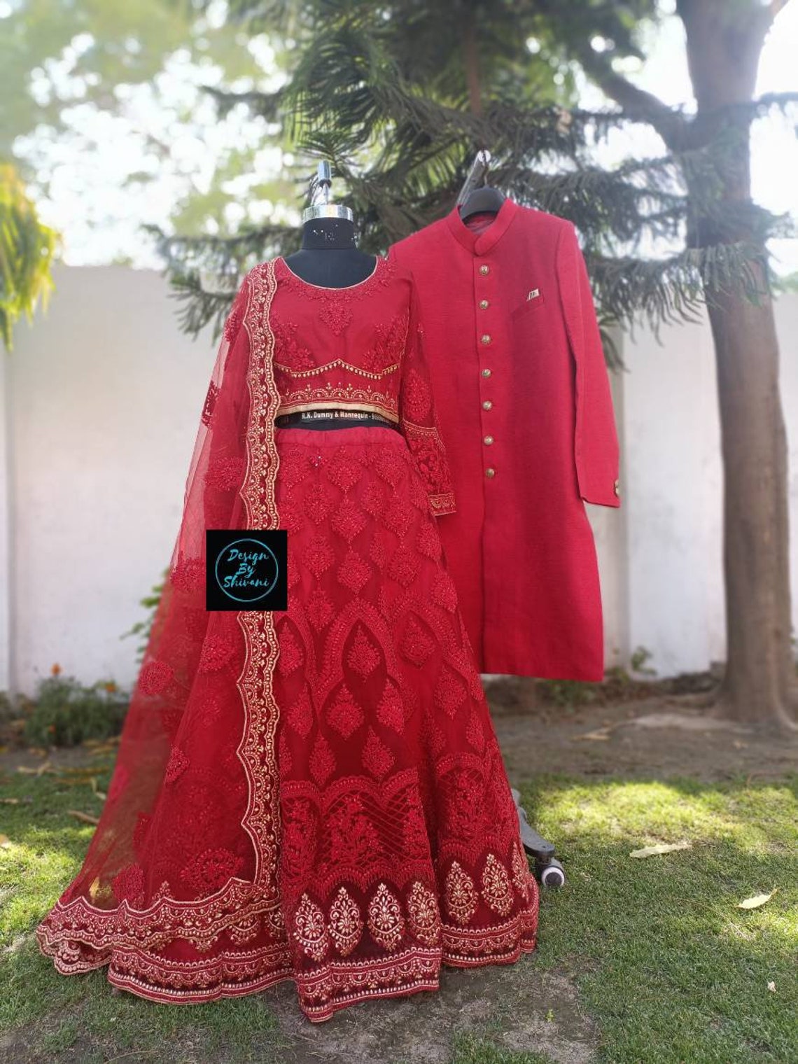 sherwani with red lehenga