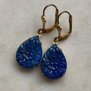 Vintage 18x13mm Pear Lapis Blue Pressed Floral Glass Dangle Earrings. Prong set patina brass setting.