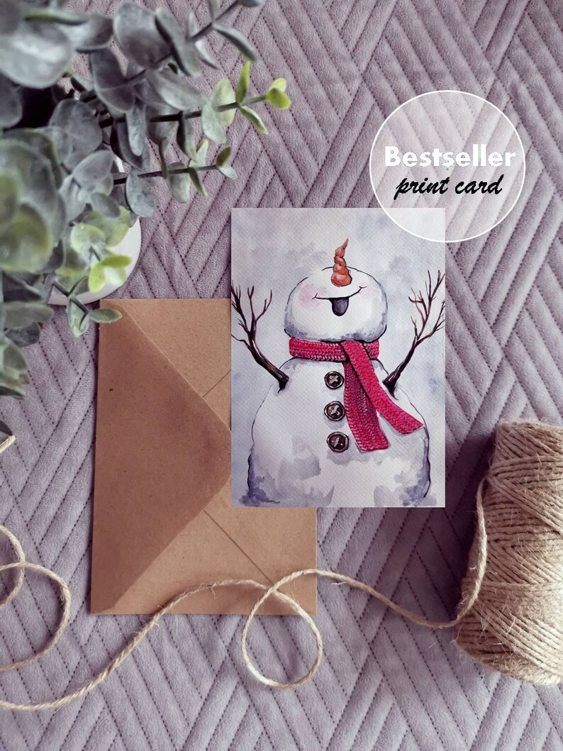May include: A watercolor painting of a snowman with a red scarf and a carrot nose. The snowman is smiling and has a tongue sticking out. The painting is on a white background.