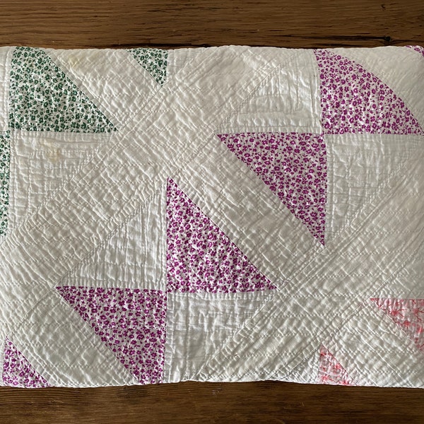 Antique bow tie block quilt, entirely hand-quilted and stitched,  white, pink, green and purple fabrics, likely from the early 1900s