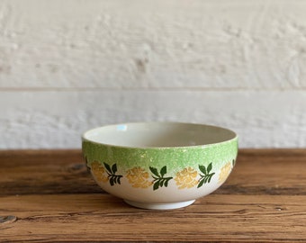 Large antique spongeware bowl, hand-painted yellow and green flowers, made in England, circa late 1800s to early 1900s