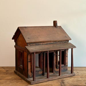 Antique hand-made wooden dollhouse, primitive small wooden cottage with square nails, from Québec, Canada, circa late 1800s-early 1900s