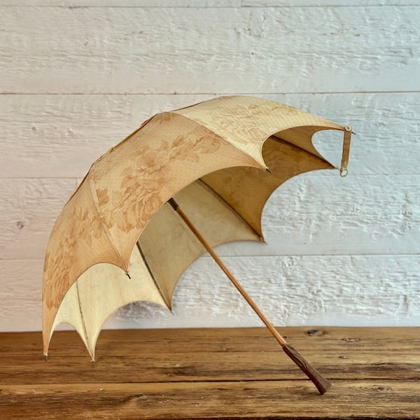 Antique Victorian linen parasol, or umbrella, with carved wooden handle, brass fittings and linen with a faded floral print, from the 1880s