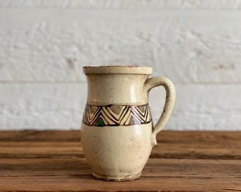 Antique primitive terra cotta jug or milk pitcher with geometric designs, from Europe