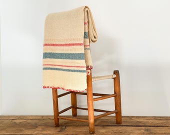 Antique beige wool blanket or throw with red, blue and peach stripes: from Québec, Canada, circa 1920s