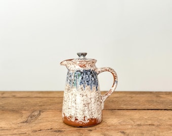 Vintage hand-made Beauceware pottery teapot with lid, brown clay jug with white and blue drip graze, from Québec, Canada, circa 1950s-60s