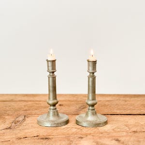 Pair of antique pewter candlestick holders, with etched designs, from Québec, Canada, circa late 1800s