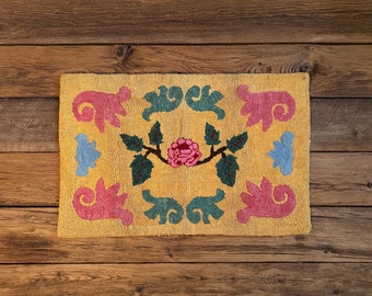 Antique wool hooked rug, hand-made hooked mat, yellow with pink, blue and green floral designs, from Quebec, Canada, circa 1940s-50s