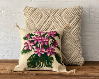 New hand-made decorative pillow made from a vintage wool needlepoint with purple and green flowers on a beige background