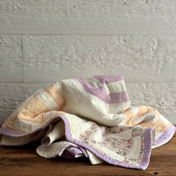 Antique block pattern quilt, with hand-quilted peach and lilac cotton fabrics, from Quebec, Canada, circa 1920s