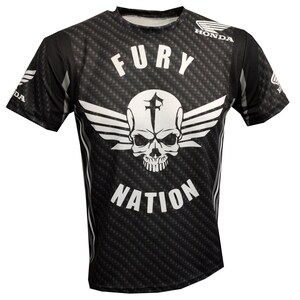 May include: Black t-shirt with a white skull and wings graphic. The text "FURY NATION" is printed below the graphic. The text "HONDA" is printed on the right shoulder.