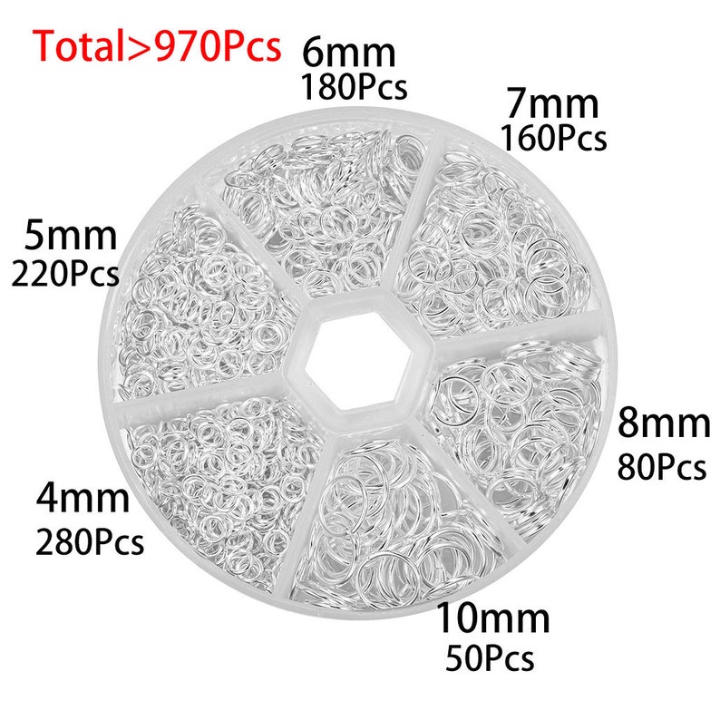 May include: A clear plastic container with six compartments filled with silver jump rings. The container is labeled with the total number of jump rings, "Total>970Pcs", and the size and quantity of each size of jump ring. The sizes are 4mm, 5mm, 6mm, 7mm, 8mm, and 10mm.