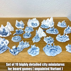 May include: Set of 19 highly detailed city miniatures for board games (unpainted Variant). The miniatures are made of white plastic and feature various buildings, towers, and other structures.
