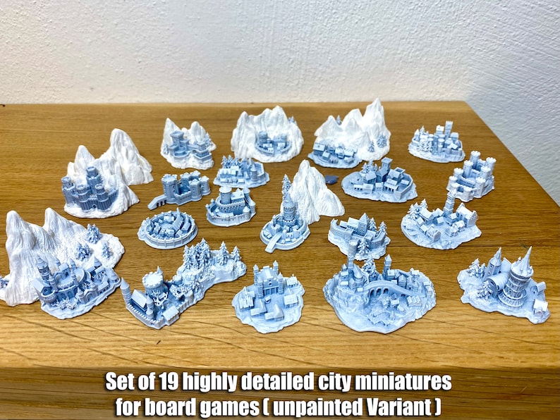 May include: Set of 19 highly detailed city miniatures for board games (unpainted Variant). The miniatures are made of white plastic and feature various buildings, towers, and other structures.
