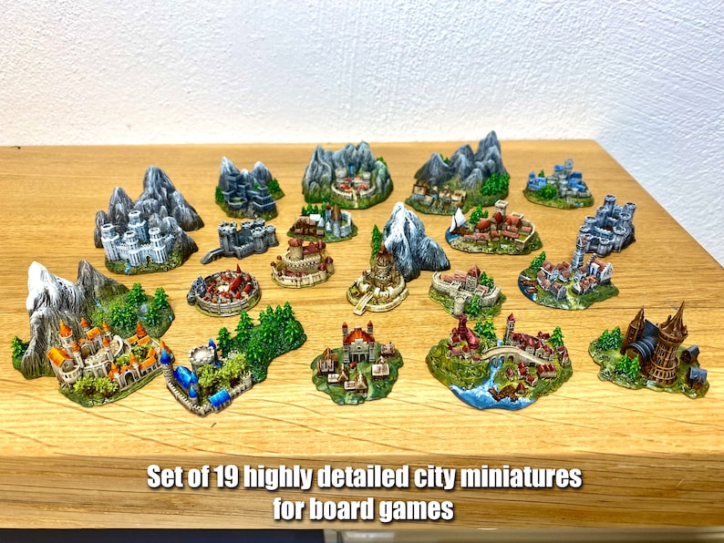 May include: Set of 19 highly detailed city miniatures for board games. The miniatures are painted in various colors and feature different styles of buildings and landscapes.