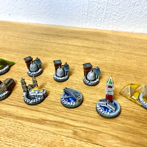 9 minor city miniatures for board games like Fortune and Glory