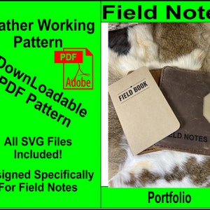 May include: A brown leather Field Notes notebook cover with a brown notebook inside. The cover has a flap that folds over the notebook and has a snap closure. The notebook is labeled "Field Book" and the cover is labeled "Field Notes". The image is on a light brown fur background. The text "Leather Working Pattern" is in green text on a green background. The text "DownLoadable PDF Pattern" is in red text on a green background. The text "All SVG Files Included!" is in white text on a green background. The text "Designed Specifically For Field Notes" is in white text on a green background. The text "Portfolio" is in white text on a green background.