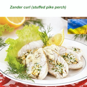 May include: Sliced stuffed pike perch, a Ukrainian dish, presented on a white plate with lettuce, dill, and lemon wedges. The filling is visible, and the dish is garnished with fresh herbs. The text "Zander curl (stuffed pike perch)" is at the top.