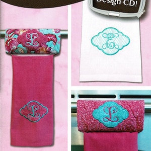 May include: A set of four monogrammed tea towel holders in different sizes. The holders are made of fabric and feature a teal blue monogram in a cloud-shaped design. The holders are shown hanging on a towel rack. The image also includes the text "Pickle Pie Designs" and "Exclusive Hoop Envy Design CD!"