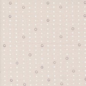 May include: Beige fabric with a repeating pattern of white and gray circles. The circles are arranged in a grid-like fashion, creating a textured and visually appealing design. The fabric has a subtle, neutral color palette.