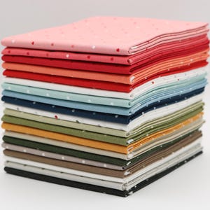 May include: A stack of 18 fabric squares with a white polka dot pattern on a variety of colors, including pink, red, orange, blue, green, brown, and black.