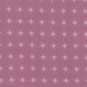 May include: A pink fabric with a white grid pattern. The grid pattern is made up of small, white lines that form squares.