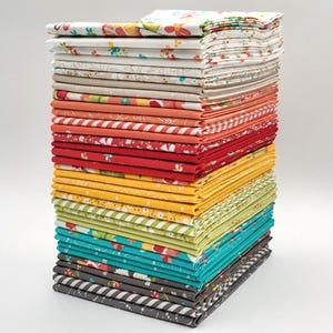 May include: A tall stack of folded fabric squares in various colors and patterns. The fabrics include floral, striped, and geometric designs in shades of red, yellow, green, blue, and gray. The stack is neatly arranged on a white surface.