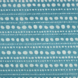 May include: Teal fabric with a white polka dot pattern. The dots are arranged in horizontal rows with alternating sizes.