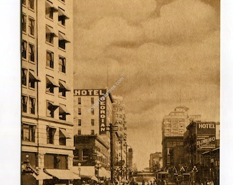 May include: A sepia-toned vintage postcard showing Fourth Avenue in Seattle, Washington, looking south. The scene features multi-story buildings, including the Hotel Georgian, horse-drawn carriages, early automobiles, and street lamps.
