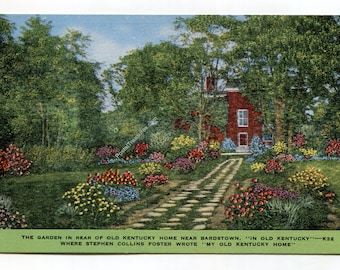 May include: A vintage postcard depicting a red brick house surrounded by lush greenery and colorful flower beds. A stone path leads to the house, with the text "THE GARDEN IN REAR OF OLD KENTUCKY HOME..." at the bottom.