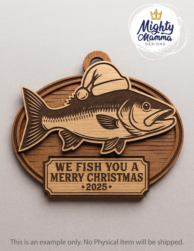 May include: Wooden Christmas ornament featuring a fish wearing a Santa hat. The ornament has a dark brown fish design on a lighter wood background. Text on the ornament reads "WE FISH YOU A MERRY CHRISTMAS &bull;2025."