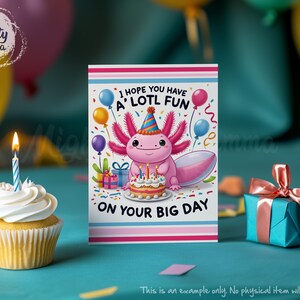 May include: A pink birthday card featuring a cartoon axolotl wearing a party hat and holding a birthday cake. The card reads "I hope you have a lotl fun on your big day".