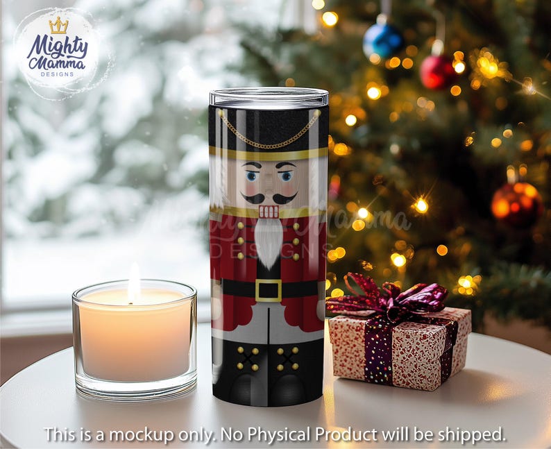 May include: A stainless steel tumbler with a red, white, and black nutcracker design. The nutcracker is wearing a red and white hat and has a black mustache.