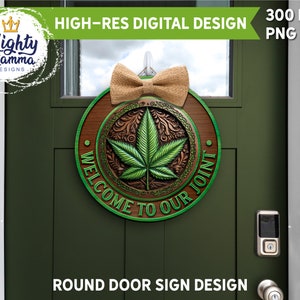 May include: A round wooden door sign with a green marijuana leaf design and the text "Welcome to our joint". The sign has a brown burlap bow.