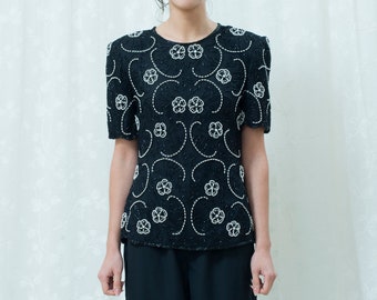 80s black beaded silk evening blouse medium | big shoulder dynasty black white flower beading blouse | short sleeve floral evening blouse
