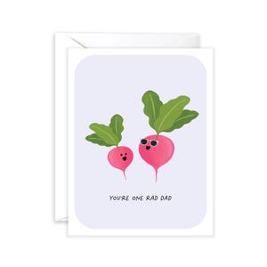 May include: Greeting card with a light purple background featuring two cartoon radishes. One radish wears sunglasses. The text "YOU'RE ONE RAD DAD" is printed in black. The card is inside a white envelope.