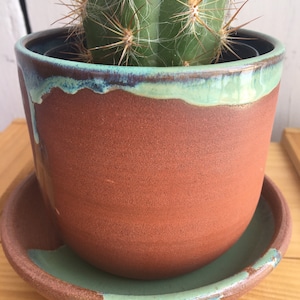 Green and terra cotta ceramic indoor planter and saucer