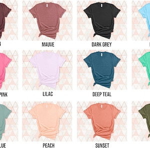 May include: A selection of blank t-shirts in various colors, including maroon, mauve, dark grey, ice blue, charity pink, lilac, deep teal, mint, dusty blue, peach, sunset, and olive.
