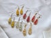 Handmade Resin Earrings teardrop shaped with real pressed baby breaths gold flakes silver flakes 18k gold plated hooks stainless steel hooks 