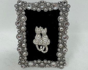 Vintage Rhinestone Cats Brooch in Miniature Ornate Frame - Exquisite Jewelry Art for Cat Lovers, Displayed on Luxurious Black Velvet