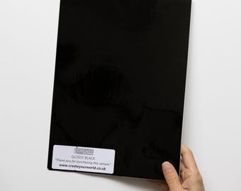 Muestra de vinilo autoadhesivo negro brillante d-c-fix tamaño A4