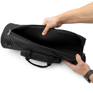 May include: Black padded carrying case with a zipper closure and a handle. The case is open and the inside is lined with black fabric.