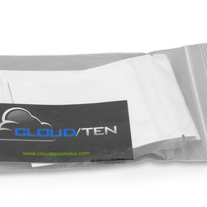 May include: A clear plastic bag with a zipper closure containing a stack of white cotton pads. The bag has a black label with the text "CLOUD/TEN" and the website address "www.cloudtensmoke.com".