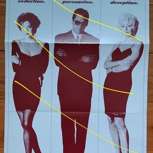 May include: Poster with the text "SUSPENSEFUL AND EROTIC!" and three figures in red. The text below reads "The art of seduction," "The power of persuasion," and "The thrill of deception."