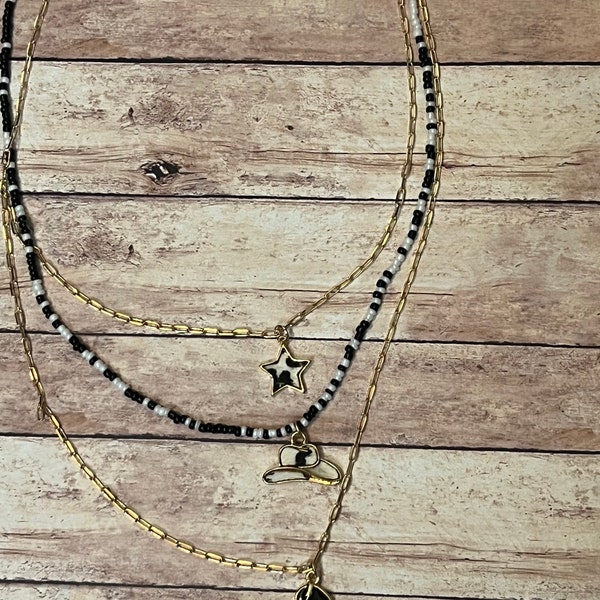 Black and white multi layered cowboy beaded necklace. Cowboy hat necklace. Cowboy boot necklace. Beaded necklace. Western jewelry