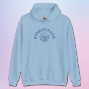 Broderad hydrokinetisk huvtröja | KOTLC | De förlorade städernas bevarare |