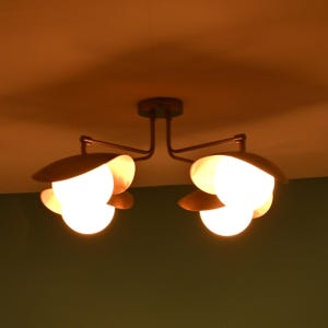 Contemporary 4-Light Ceiling Fixture With Brass Arms, Opal Glass Globes, And Warm Copper Tone Shades