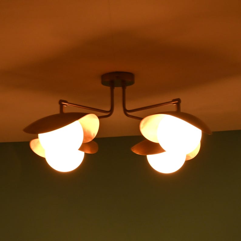 Contemporary 4-Light Ceiling Fixture With Brass Arms, Opal Glass Globes, And Warm Copper Tone Shades